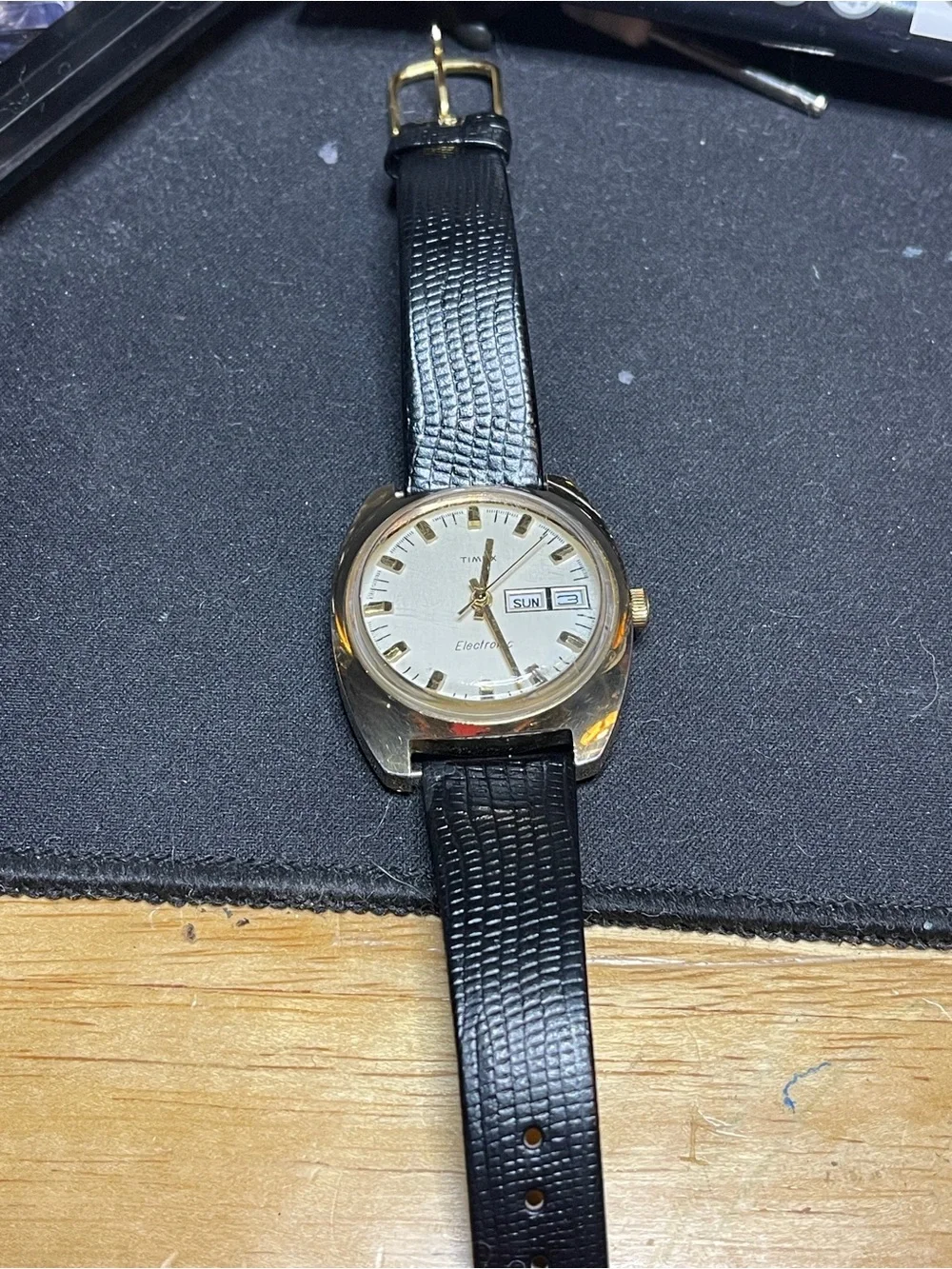 Timex Gold Tone Watch with Black Strap and White Dial